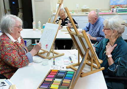 Group of seniors enjoying an art class at Westerwood.