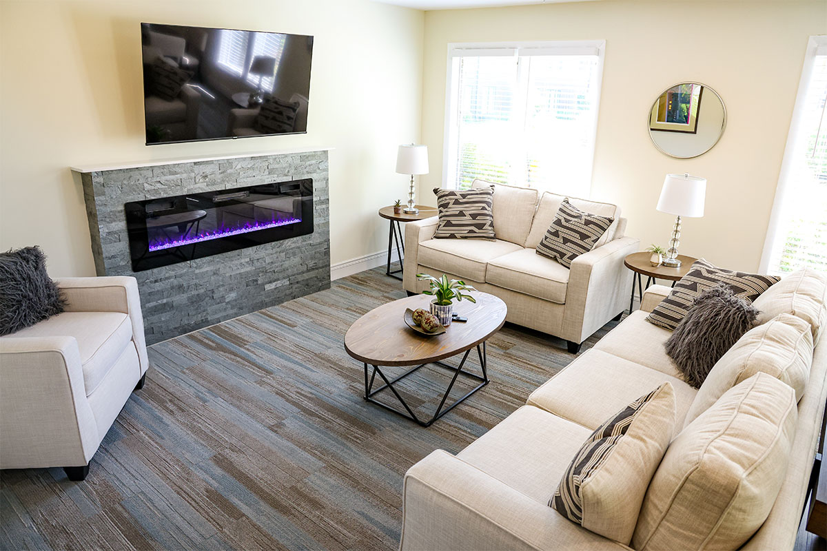 Garden lounge with couches and a fireplace.
