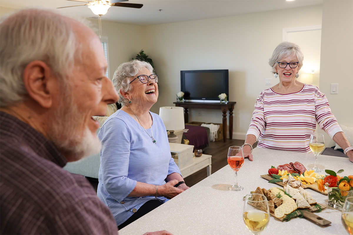 Friends laughing and having fun at a party.