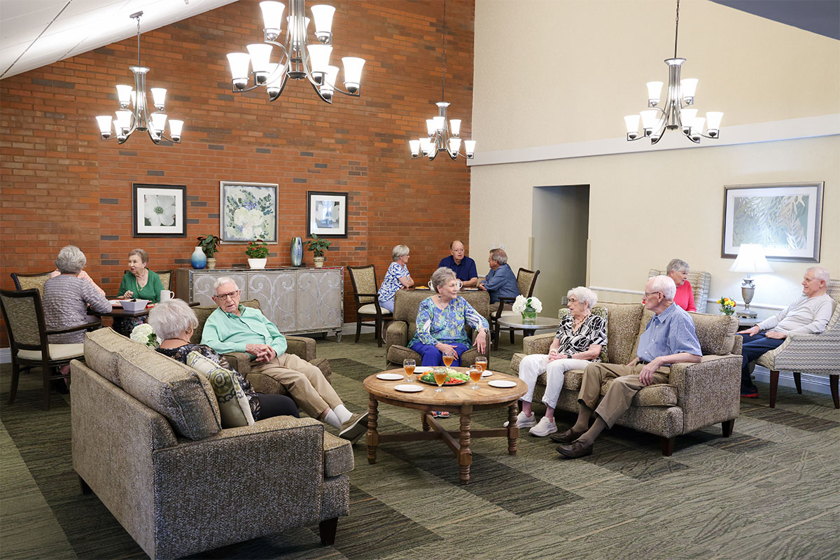 Westerwood residents talking and playing games in the Friendship Lounge.