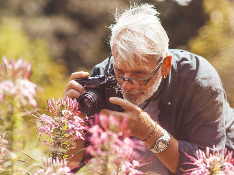 senior man practicing photography