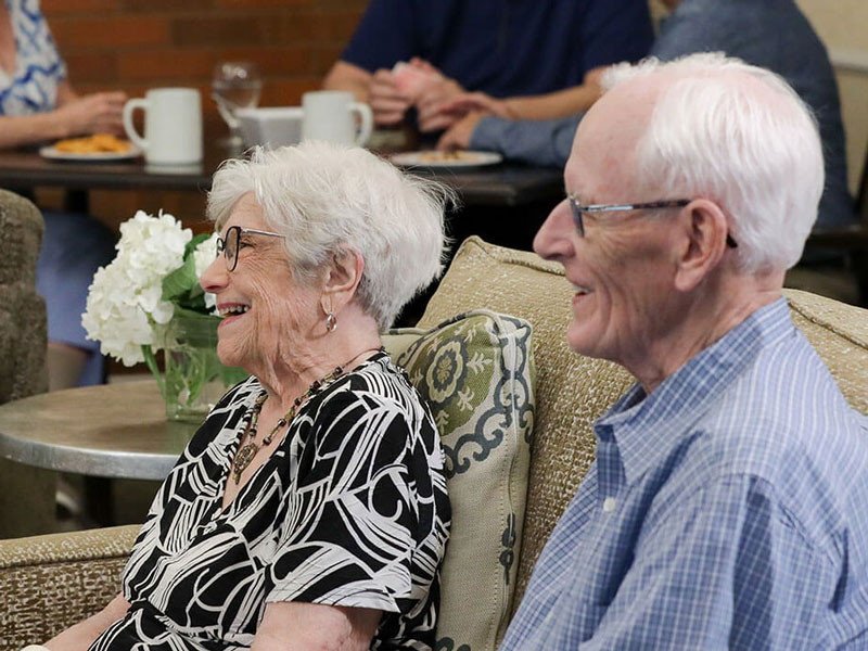 couple in lounge smiling