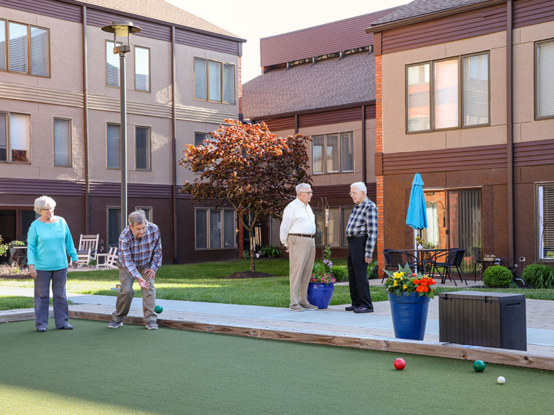 friends playing bocce ball on the Westerwood campus