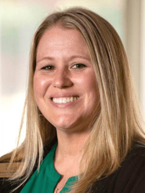 portrait of a person with shoulder-length blonde hair