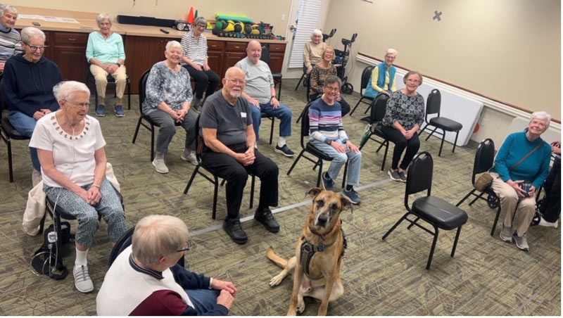 Community Gathering with Therapy Dog